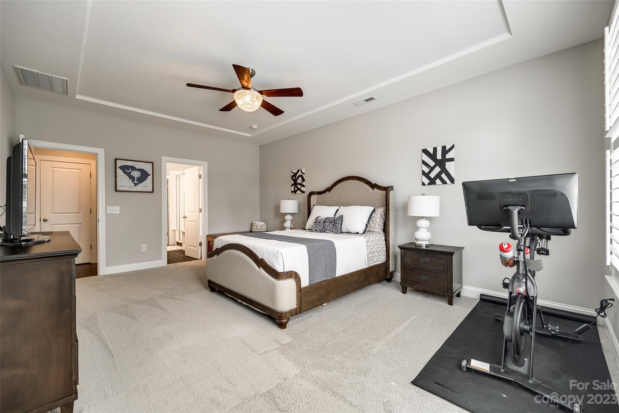 201 Helton Lane Fort Mill, SC 29708 - Photo 9 of 47 a bedroom with a bed window and a flat screen tv