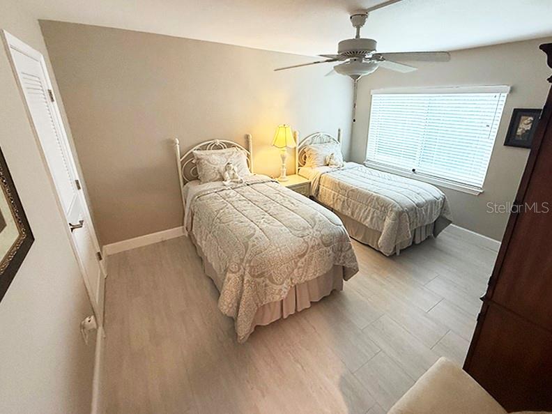 4455 Duhme Road, Unit 103 St. Petersburg, FL 33708 - Photo 24 of 37 a bedroom with two beds and a window
