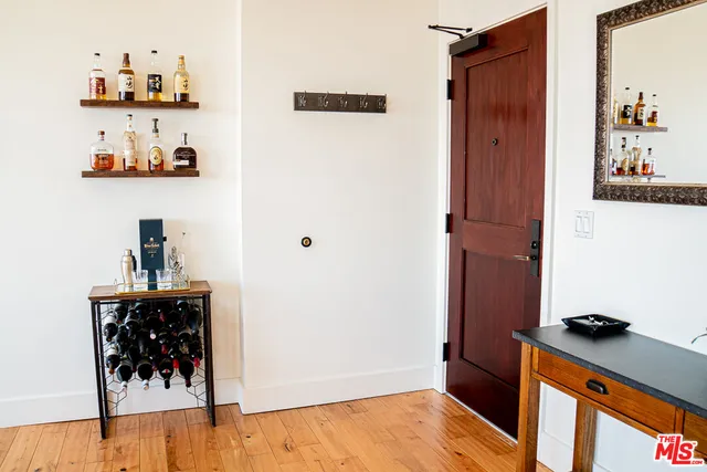 a view of a living room and kitchen with a large window