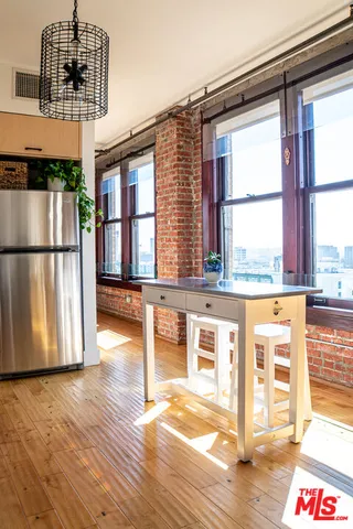 a view of a living room with a large window