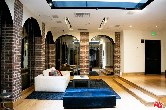a view of a lobby with black carpet