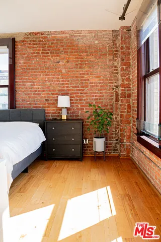 a room with a bed and a sink