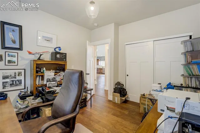 a view of a workspace with furniture and toys