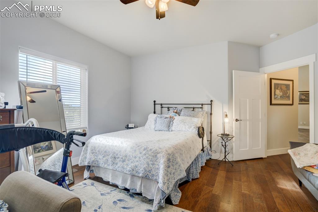 57 Cradle Lake Place Divide, CO 80814 - Photo 14 of 48 a bedroom with a bed and wooden floor