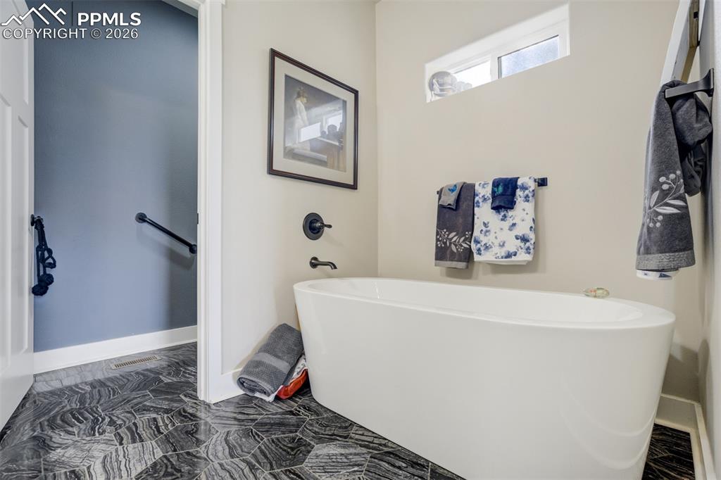57 Cradle Lake Place Divide, CO 80814 - Photo 16 of 48 a white bath tub sitting next to a white wall