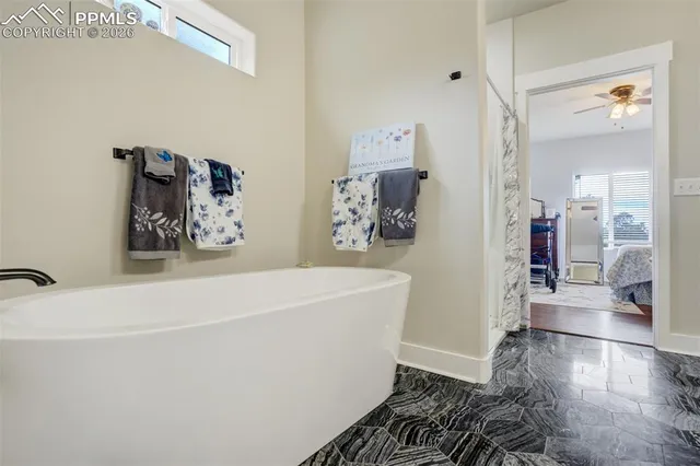 a white bath tub sitting in a bathroom