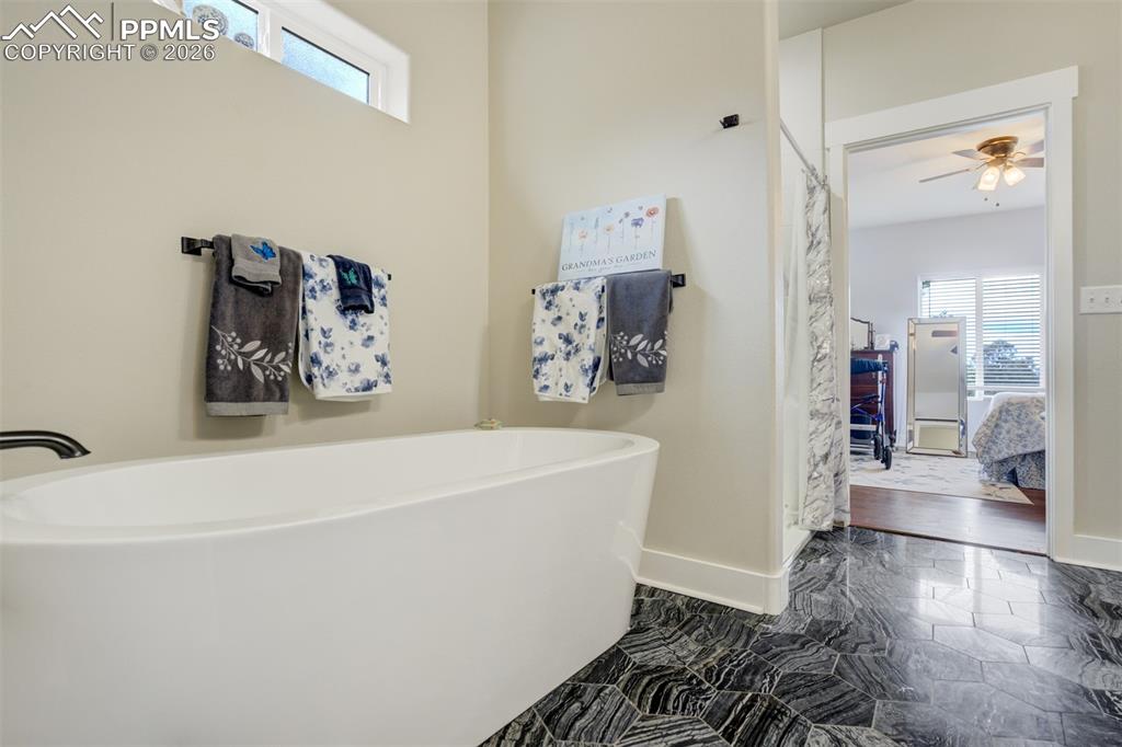 57 Cradle Lake Place Divide, CO 80814 - Photo 17 of 48 a white bath tub sitting in a bathroom