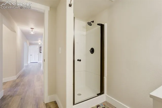 a view of a bathroom from a hallway