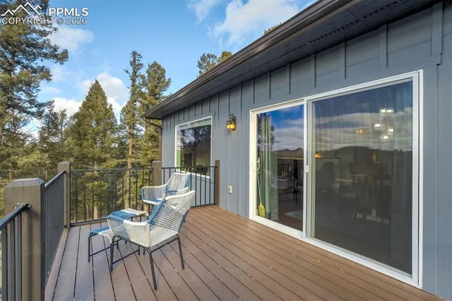 a view of a two chairs in the balcony
