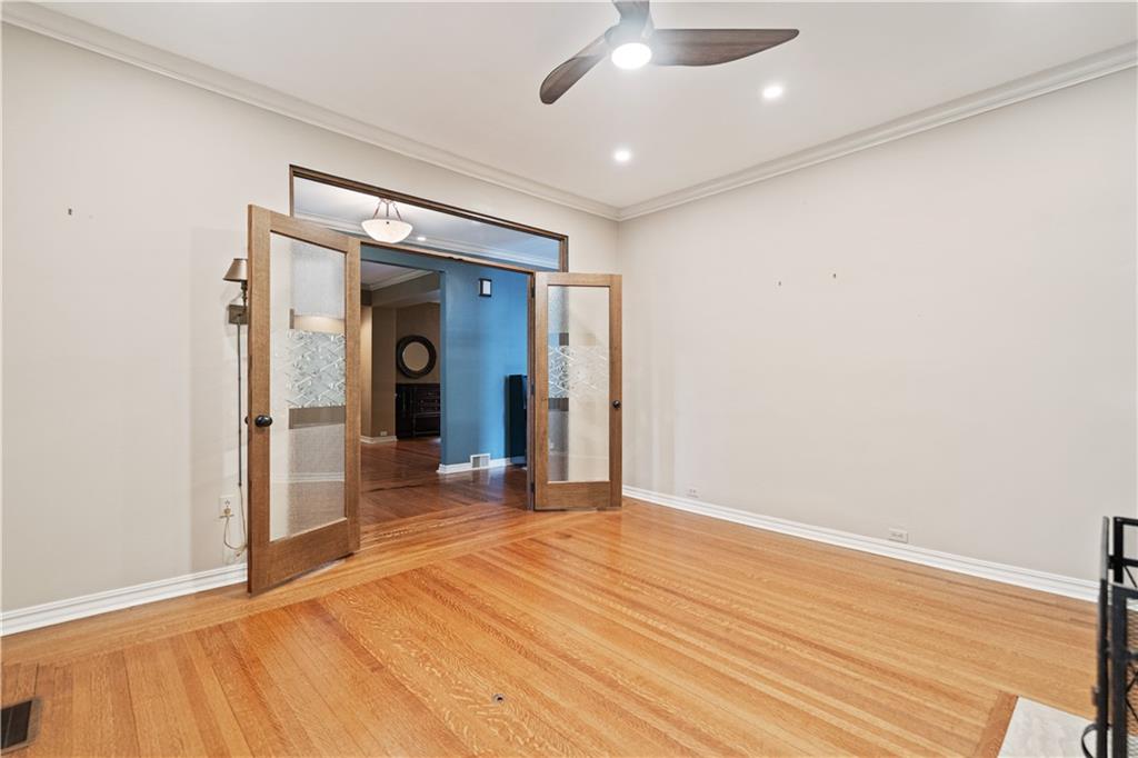 460 2nd Street Beaver, PA 15009 - Photo 14 of 50 French Doors, Ceiling Fan, Recessed Lighting, Hardwood Flooring, Crown Moulding are all wonderful features in this room. This room offers lots of flexibility in terms of uses - 1st Floor Bedroom, Home Office, Family Room, Playroom, there is no shortage of potential uses.