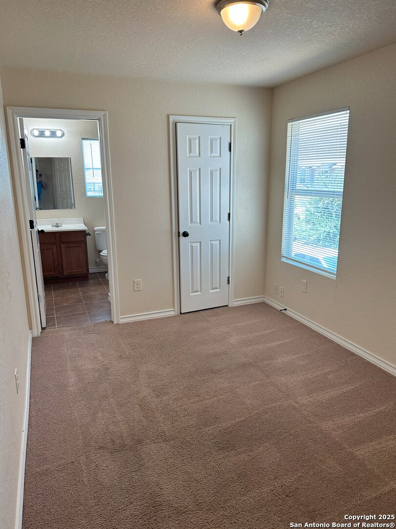 16802 Showdown Path, Unit 3 Selma, TX 78154 - Photo 17 of 22 a view of a livingroom with a furniture and a window