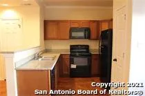 a kitchen with a sink and a microwave