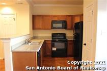 16802 Showdown Path, Unit 3 Selma, TX 78154 - Photo 4 of 22 a kitchen with a sink and a microwave