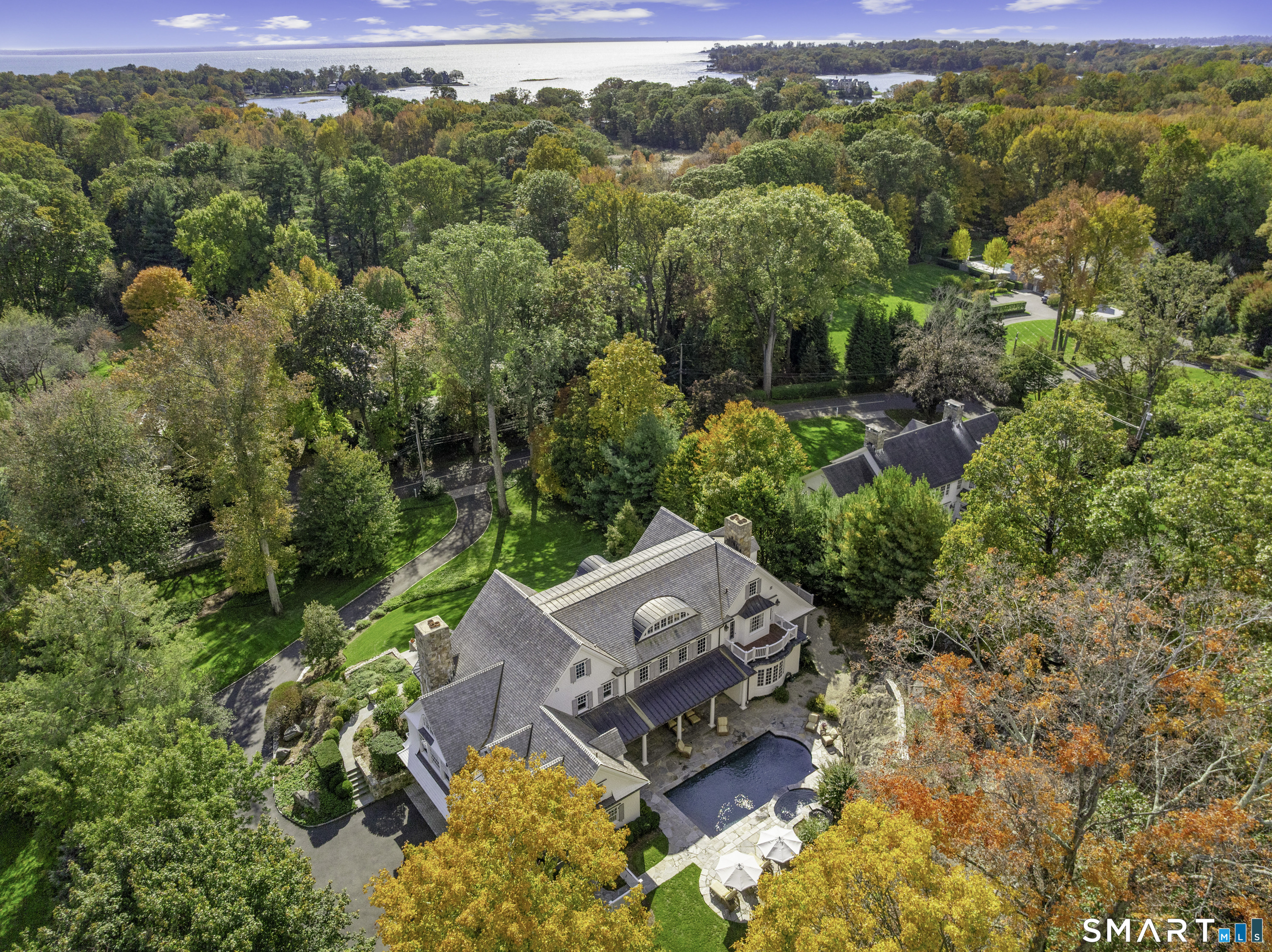 an aerial view of a house with a yard