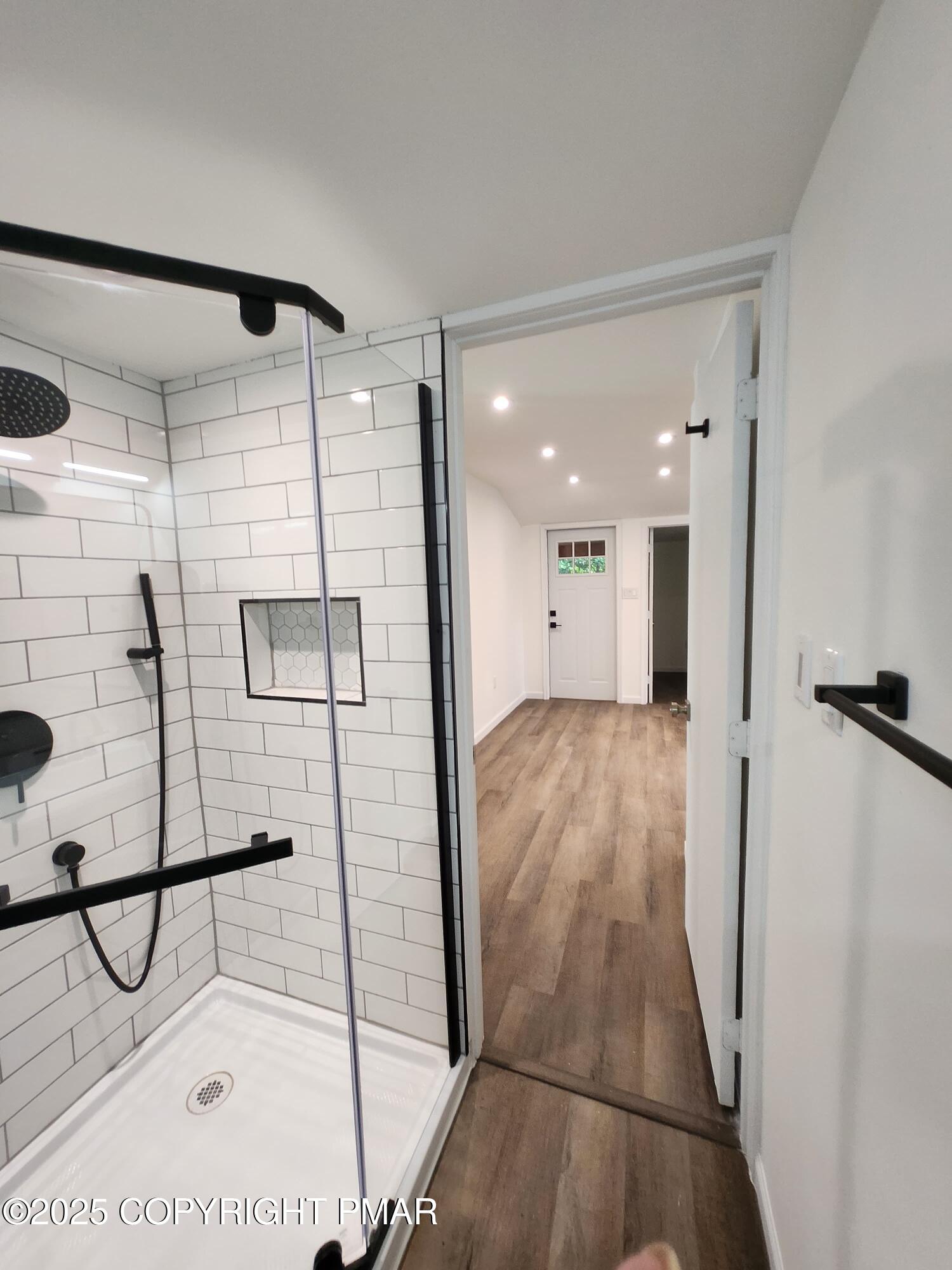 386 Hunters Farm Road Henryville, PA 18332 - Photo 16 of 18 a bathroom with a shower and mirror