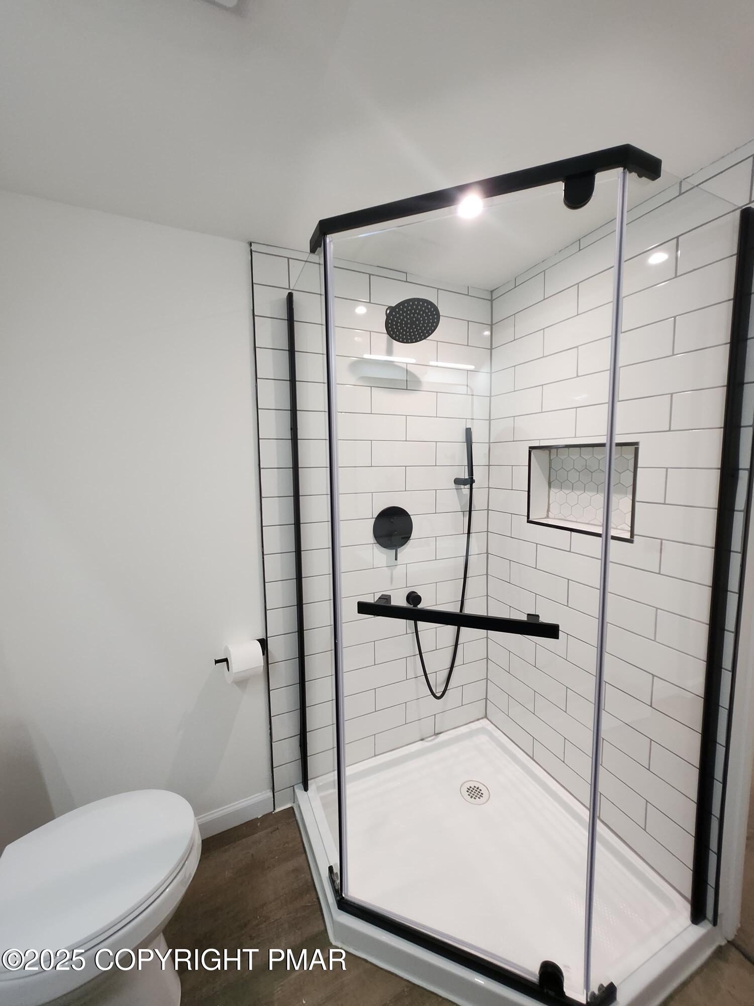 386 Hunters Farm Road Henryville, PA 18332 - Photo 18 of 18 a bathroom with a shower toilet and a sink