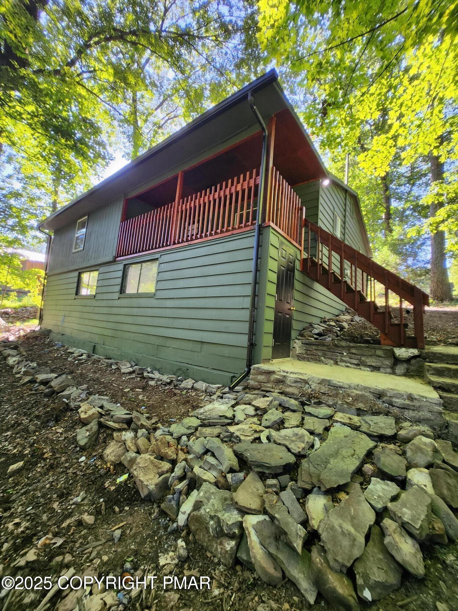 386 Hunters Farm Road Henryville, PA 18332 - Photo 2 of 18 a view of a house with a yard