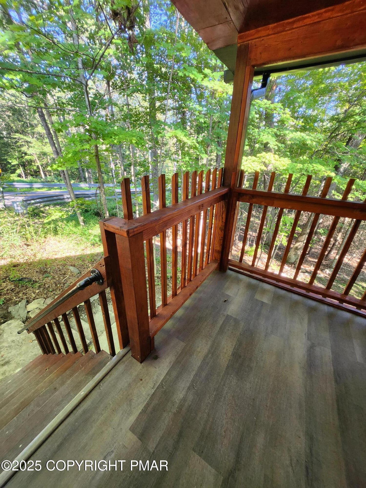 386 Hunters Farm Road Henryville, PA 18332 - Photo 3 of 18 a view of balcony with wooden floor