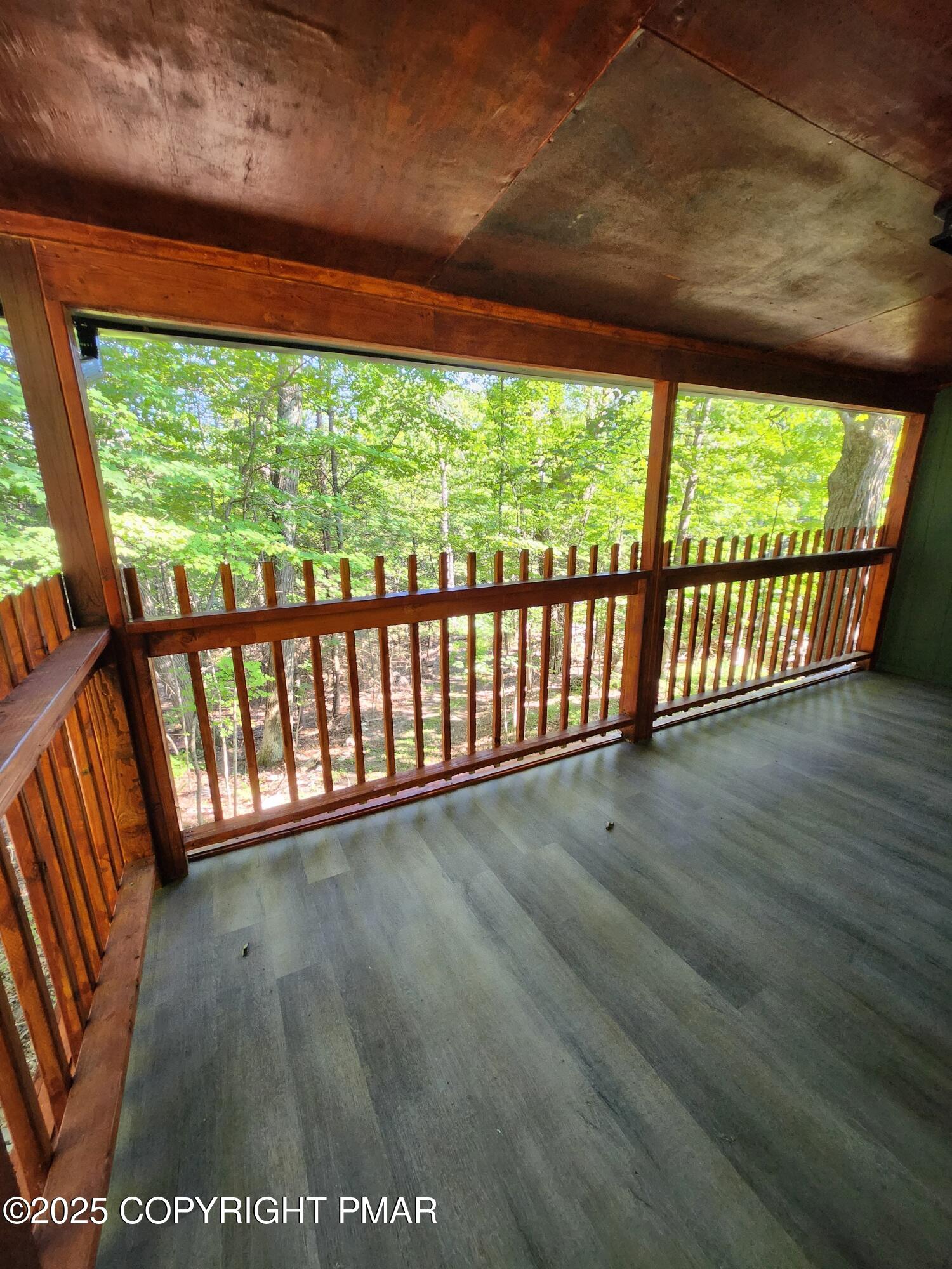 386 Hunters Farm Road Henryville, PA 18332 - Photo 4 of 18 a view of porch with a floor to ceiling window