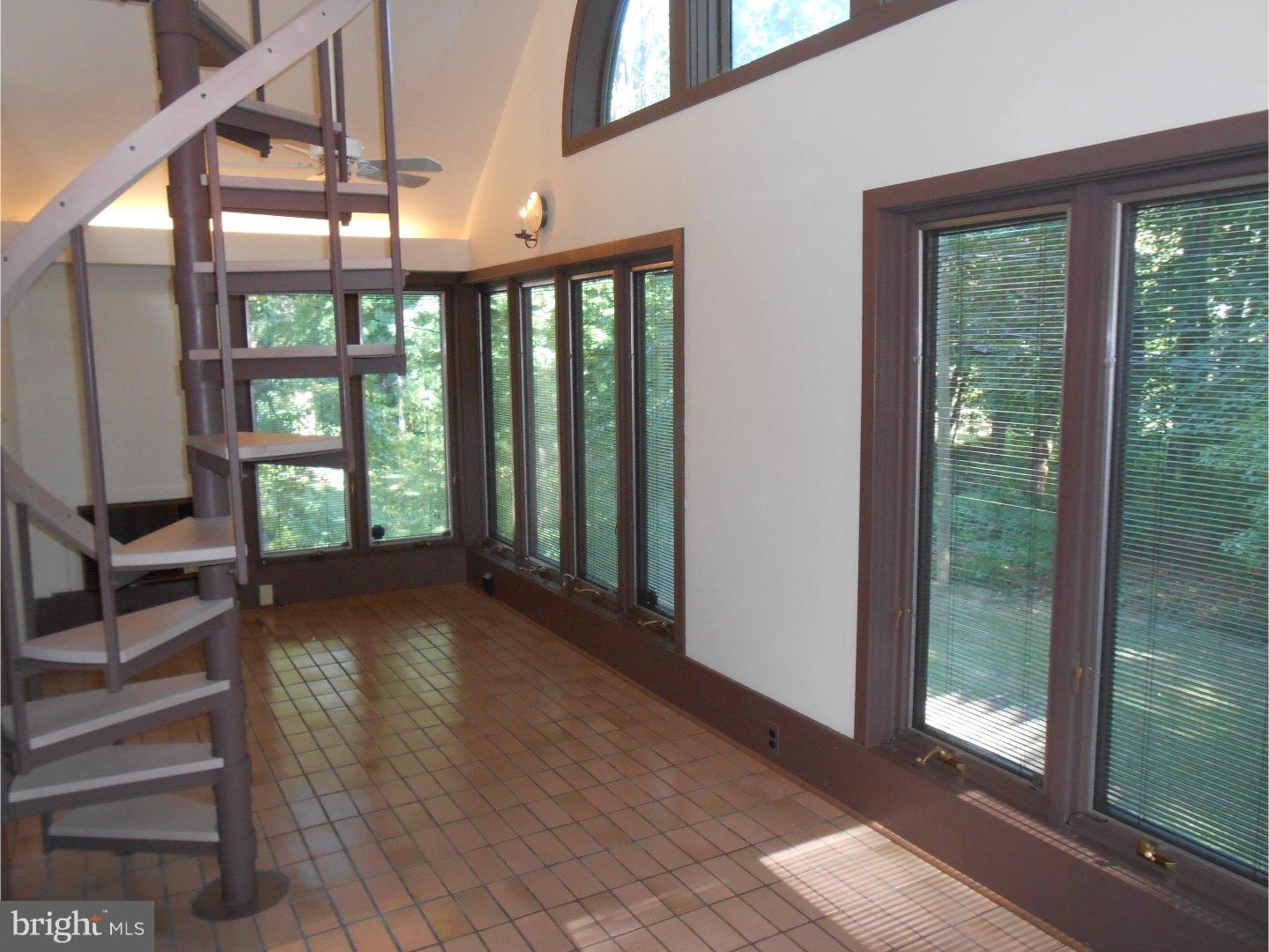 16 Peirce Road Wilmington, DE 19803 - Photo 23 of 25 a view of room with balcony and floor to ceiling windows