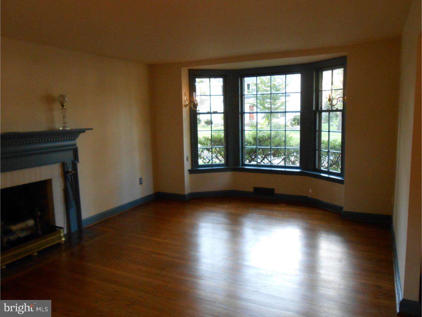 16 Peirce Road Wilmington, DE 19803 - Photo 8 of 25 a view of an empty room with wooden floor and a window