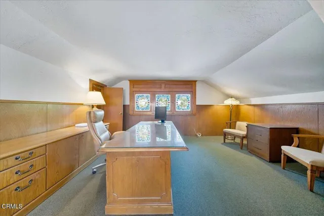 a bedroom with a bed and bathroom view