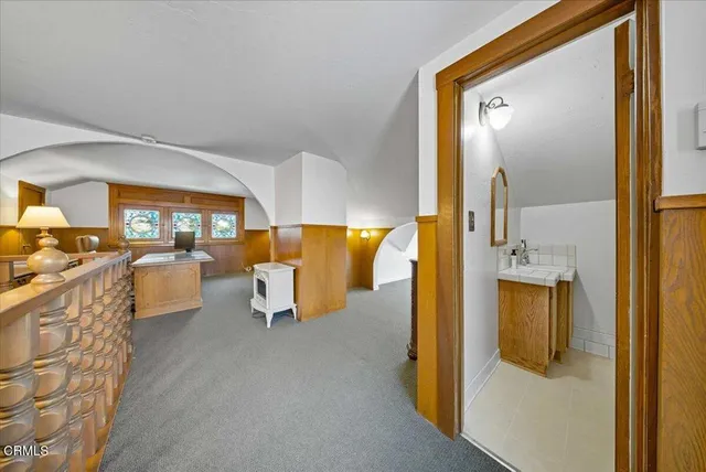 a living room with walk in closet and window