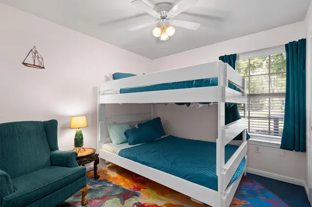 a bedroom with a bed and a table in it