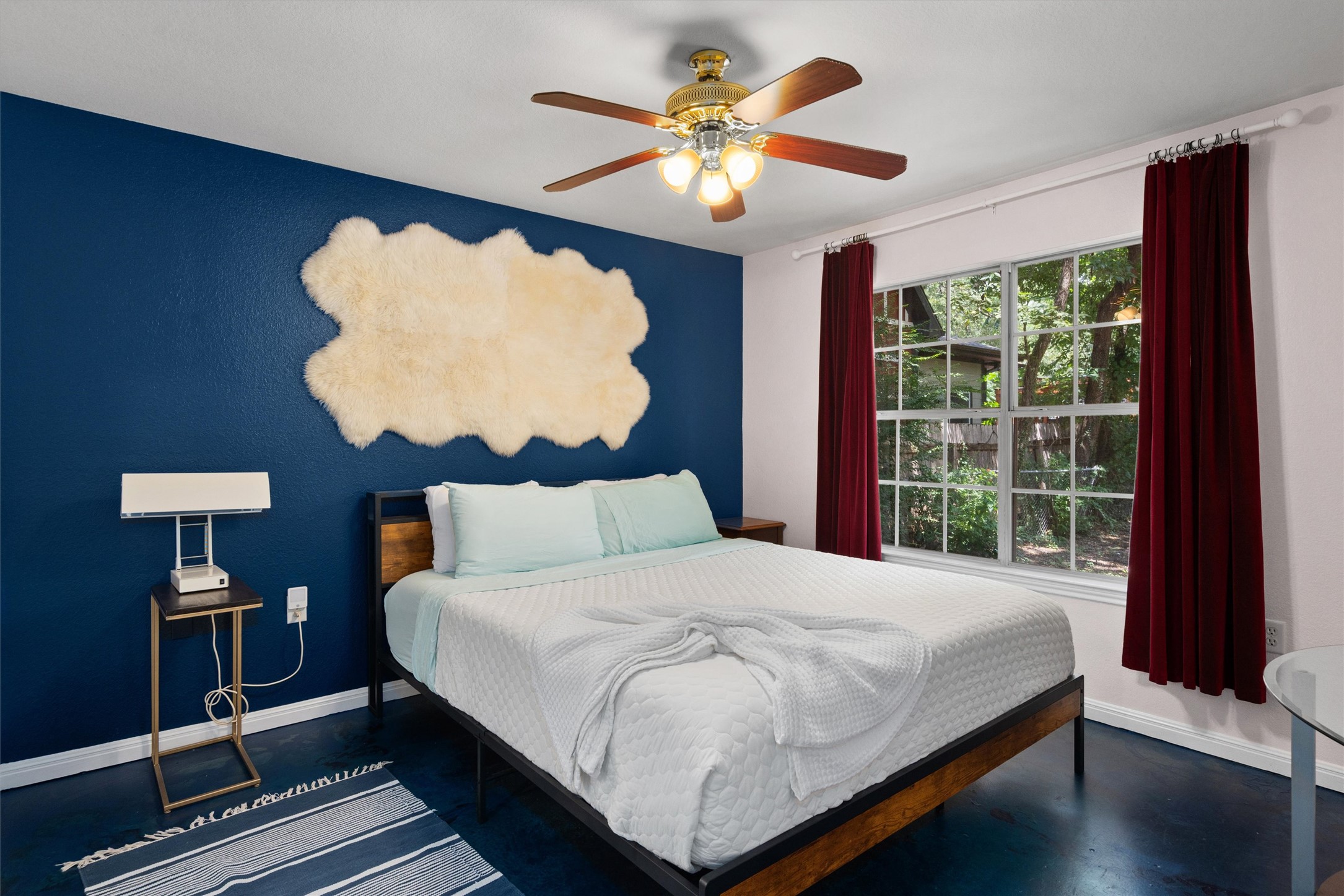 1407 Sanchez Street Austin, TX 78702 - Photo 18 of 34 Bedroom with ceiling fan and concrete floors