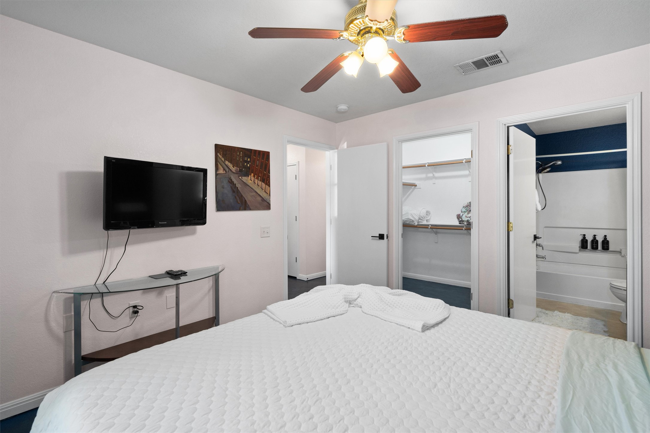 1407 Sanchez Street Austin, TX 78702 - Photo 19 of 34 Bedroom with a closet, ceiling fan, and ensuite bathroom