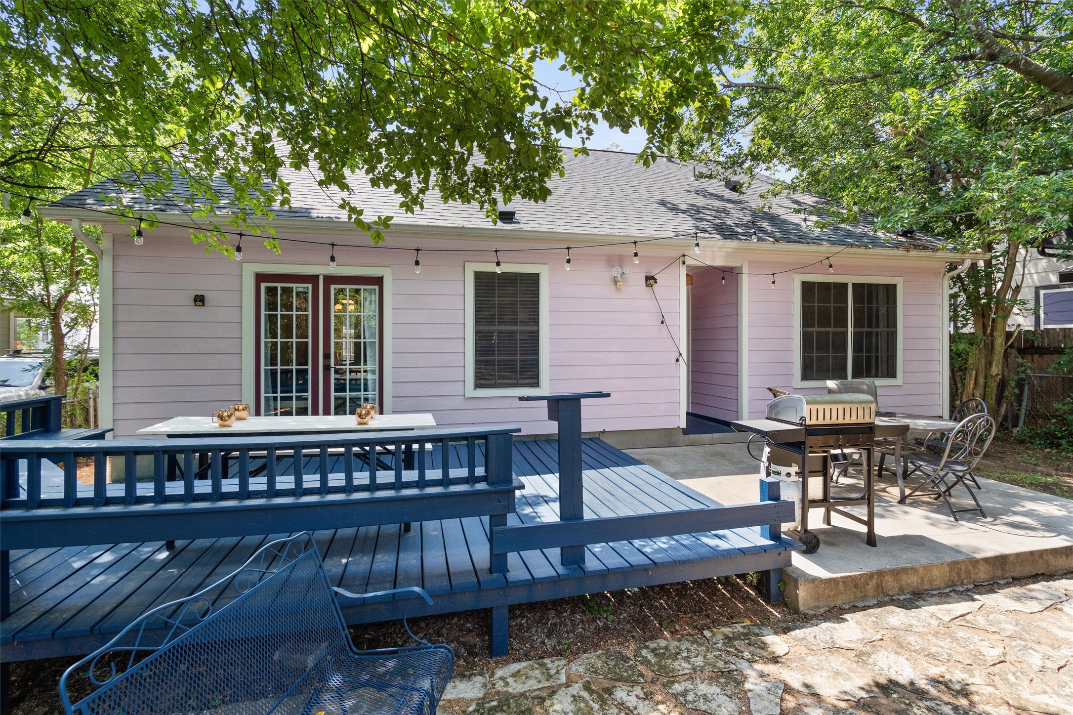 1407 Sanchez Street Austin, TX 78702 - Photo 28 of 34 Back of house with a deck, roof with shingles, a patio area, and outdoor dining area