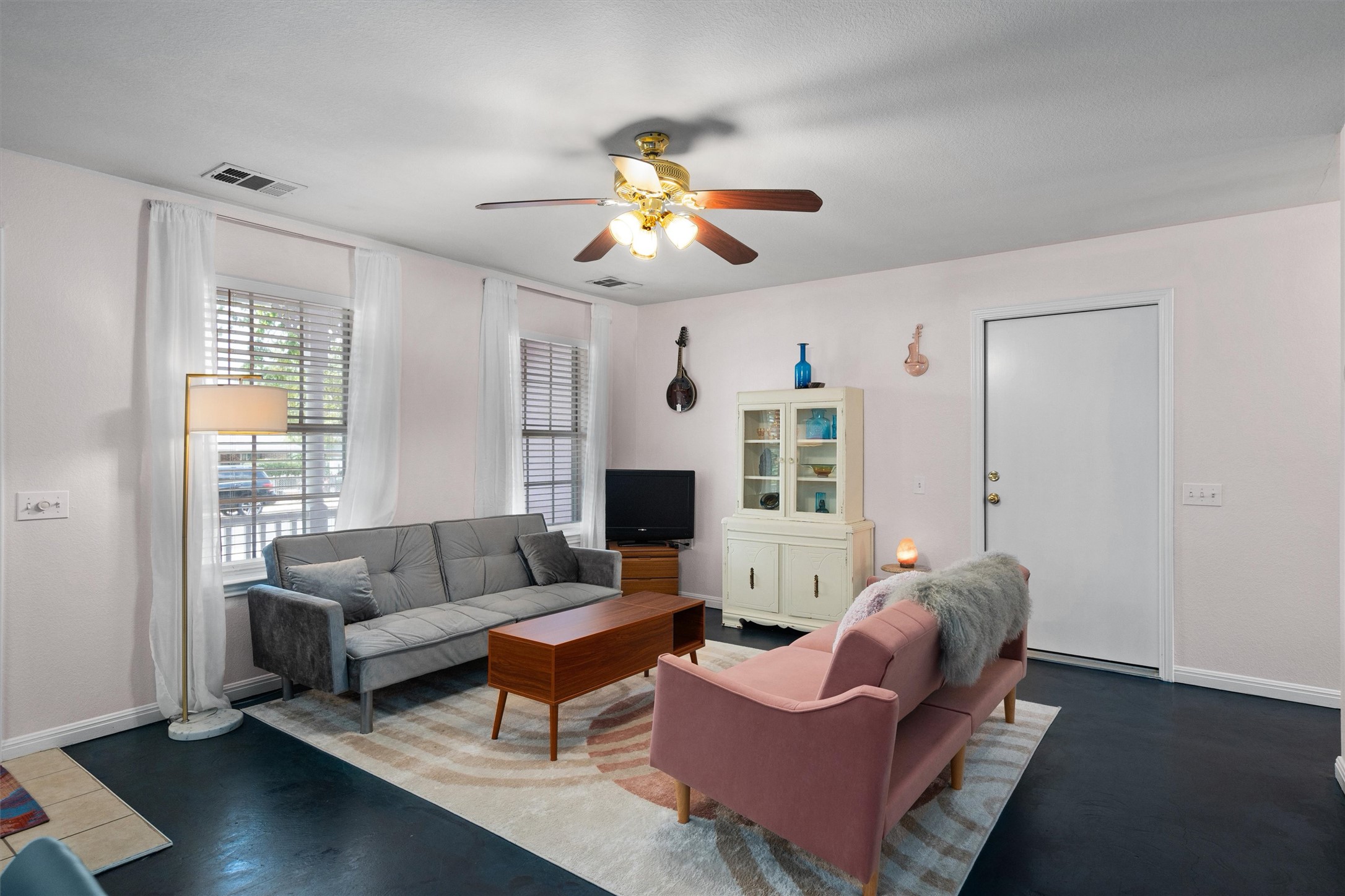 1407 Sanchez Street Austin, TX 78702 - Photo 4 of 34 Living room with a ceiling fan and concrete flooring