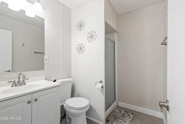 a bathroom with a sink toilet and vanity