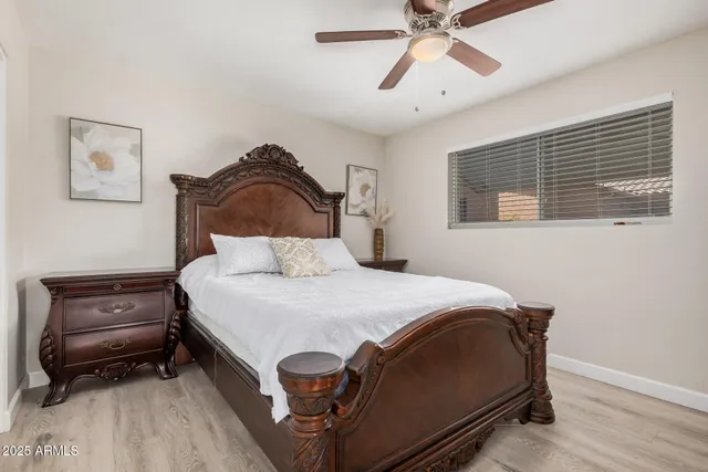 a bedroom with a bed and dresser