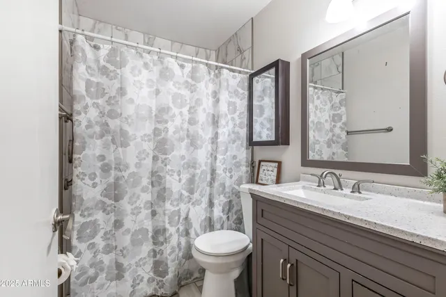 a bathroom with a sink and a toilet