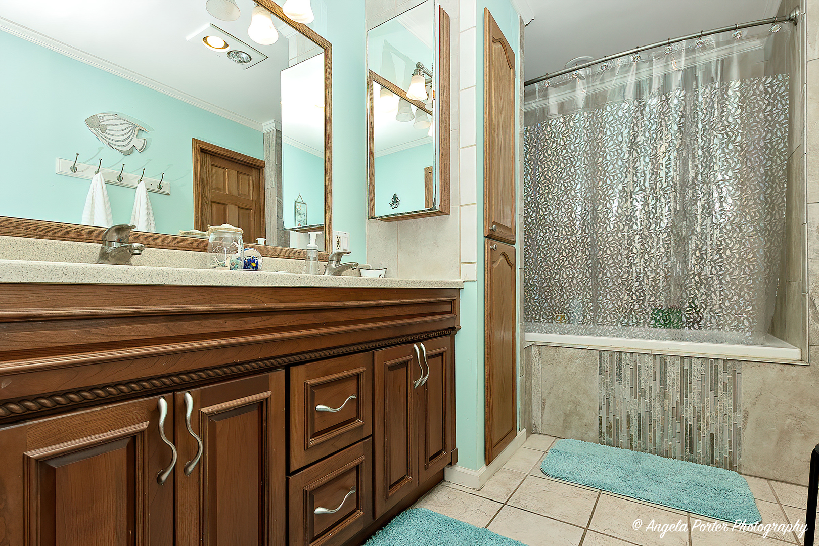 12306 Roger Road Woodstock, IL 60098 - Photo 13 of 20 a bathroom with a sink a mirror and a shower
