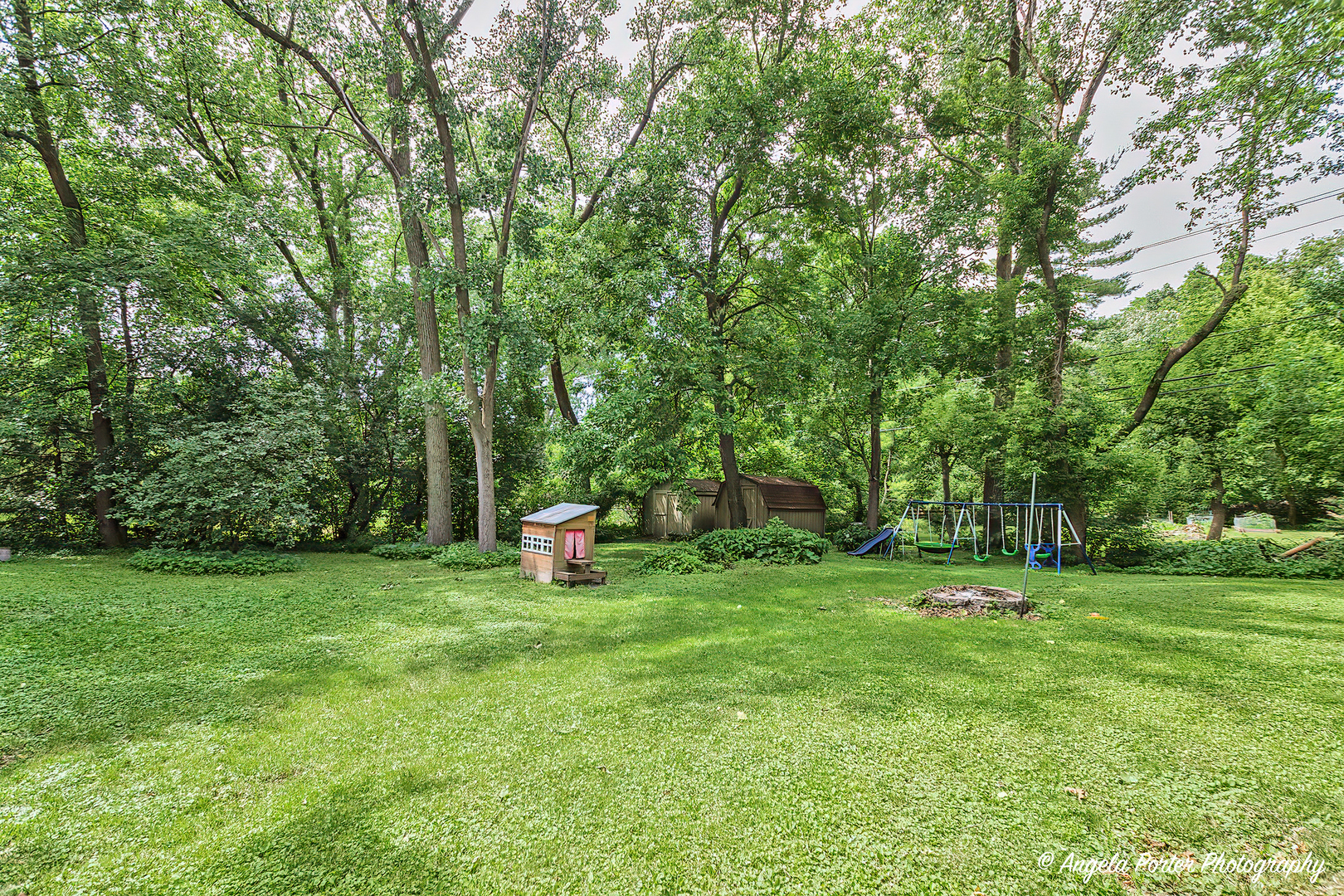 12306 Roger Road Woodstock, IL 60098 - Photo 19 of 20 a view of a park with benches and trees