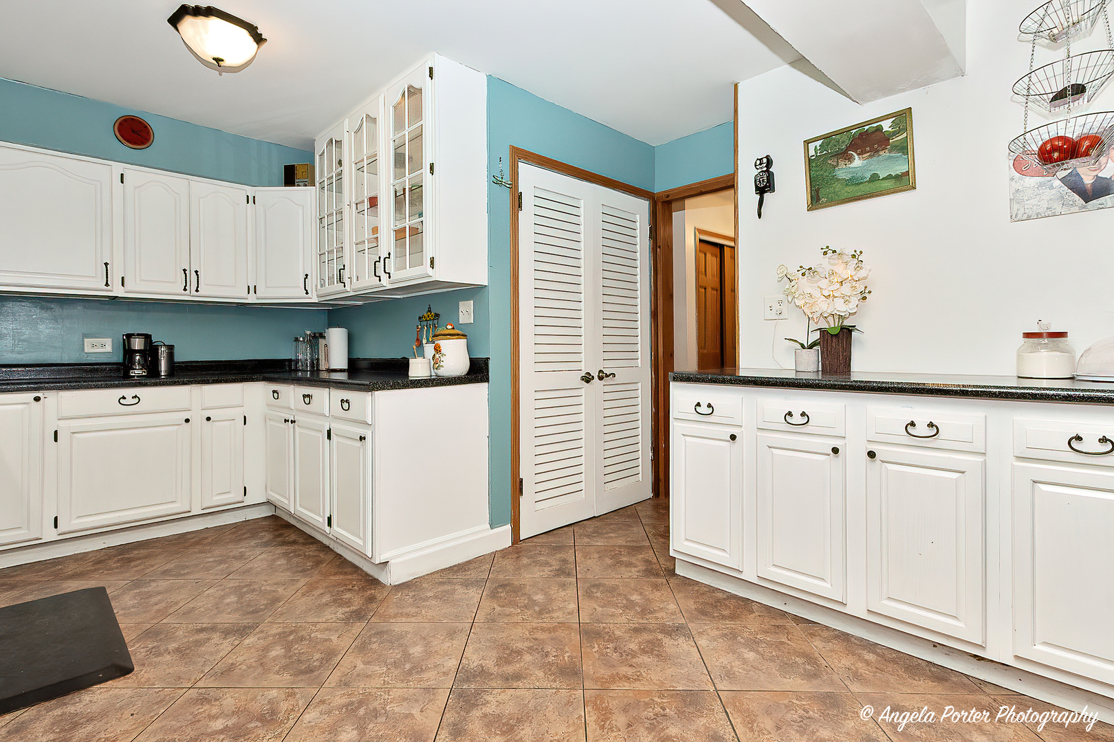 12306 Roger Road Woodstock, IL 60098 - Photo 3 of 20 a kitchen with granite countertop a sink and cabinets