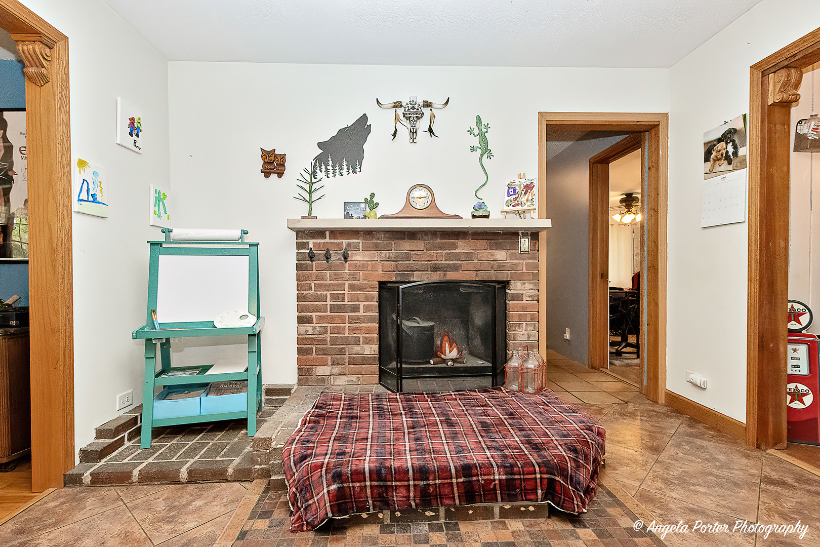 12306 Roger Road Woodstock, IL 60098 - Photo 9 of 20 a living room with a rug and a fireplace