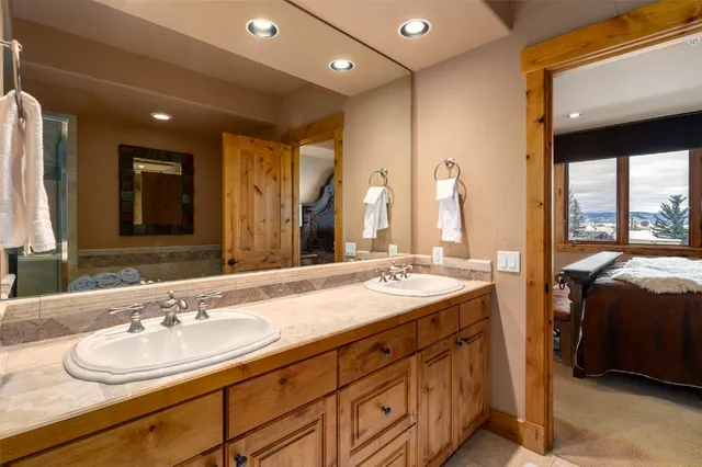a bathroom with a tub and a shower
