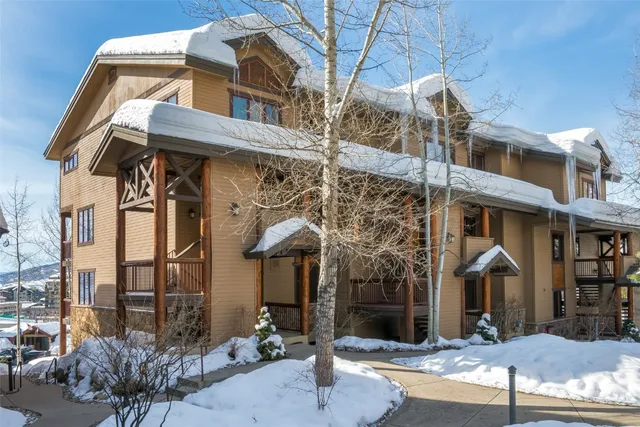 a view of a swimming pool with outdoor seating