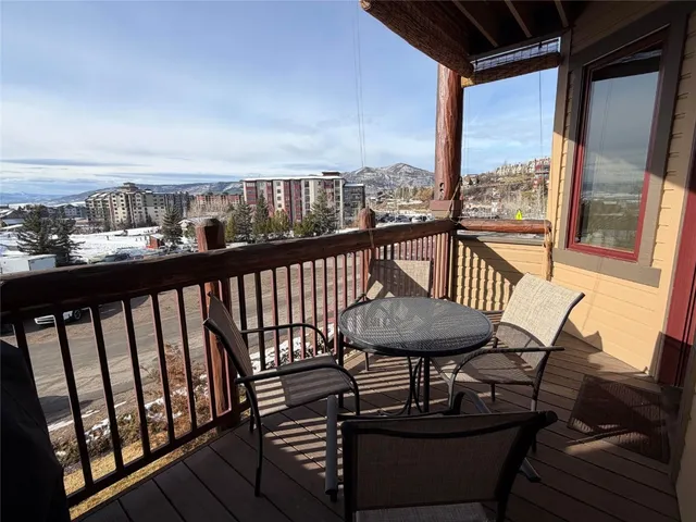 a view of a balcony with furniture