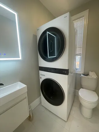 a utility room with dryer and washer