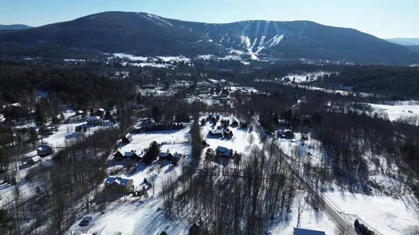 an aerial view of residential house with outdoor space