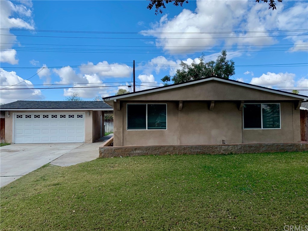 6777 La Jolla Drive Riverside, CA 92504 - Photo 1 of 1 a front view of a house with a garden