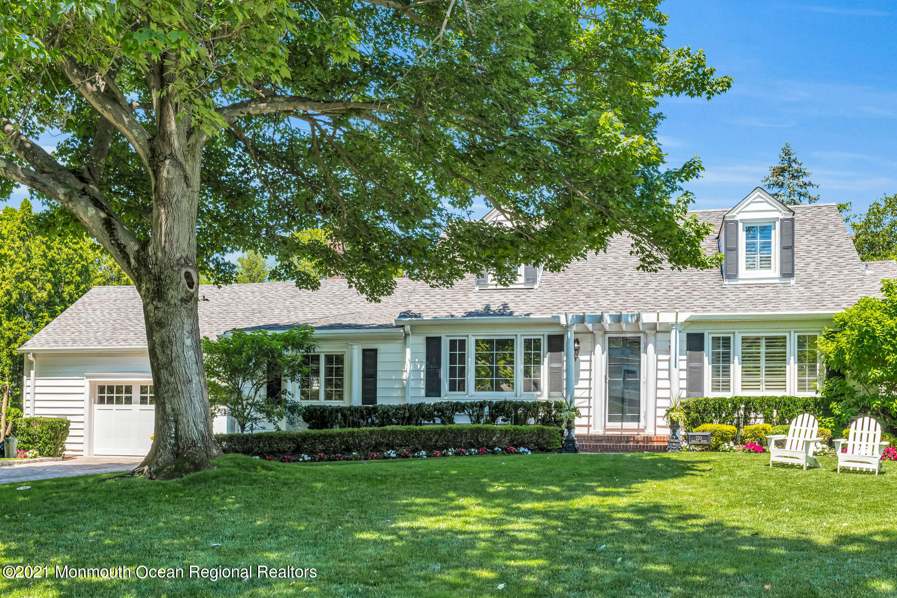 200 Lorraine Avenue Spring Lake, NJ 07762 - Photo 1 of 36 a front view of a house with a garden