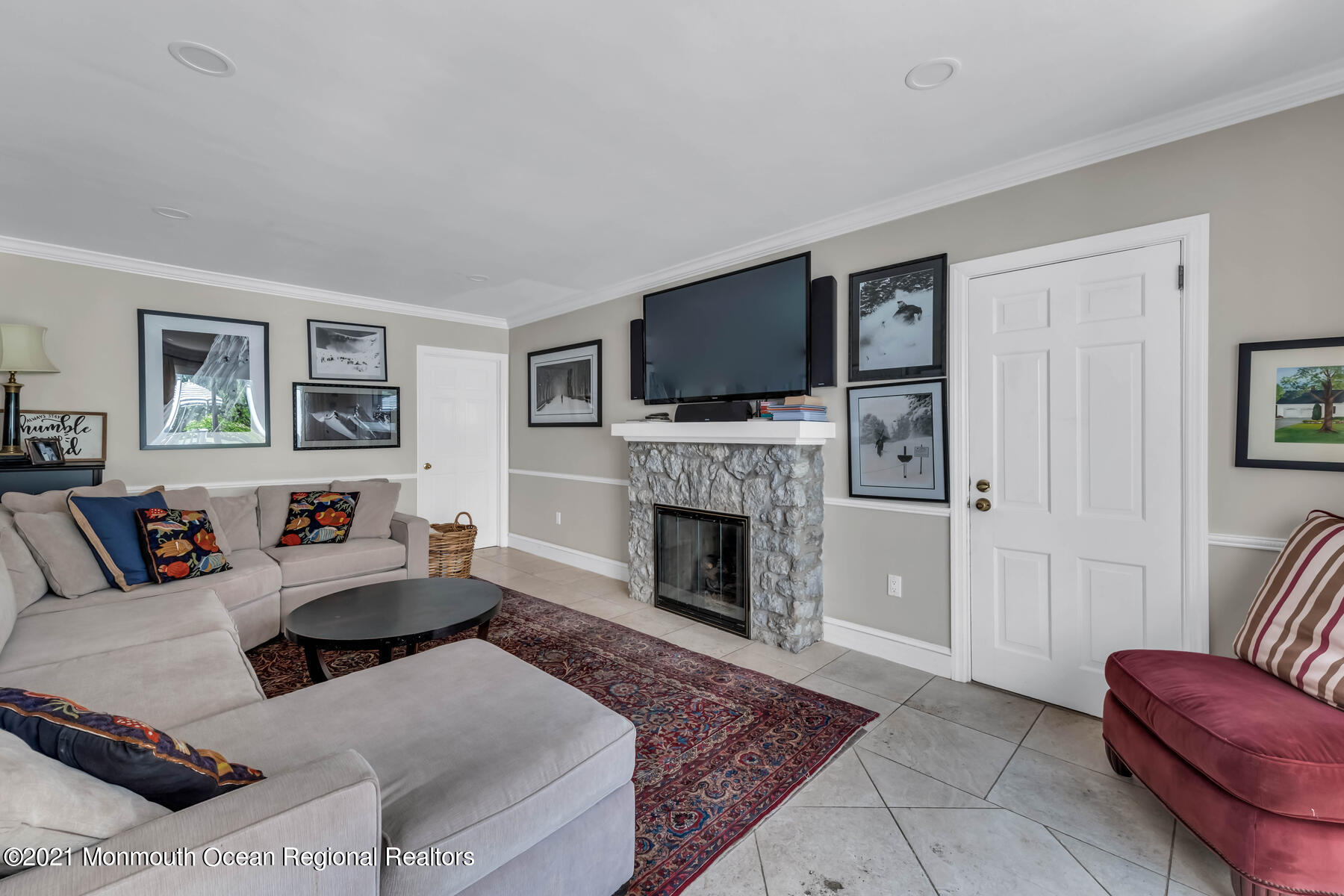 200 Lorraine Avenue Spring Lake, NJ 07762 - Photo 13 of 36 a living room with furniture a flat screen tv and a fireplace
