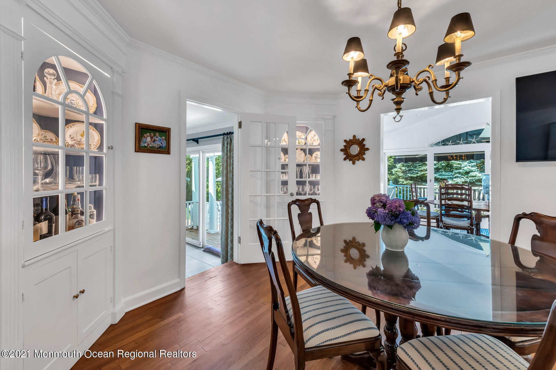 200 Lorraine Avenue Spring Lake, NJ 07762 - Photo 15 of 36 a view of a dining room with furniture a chandelier and wooden floor