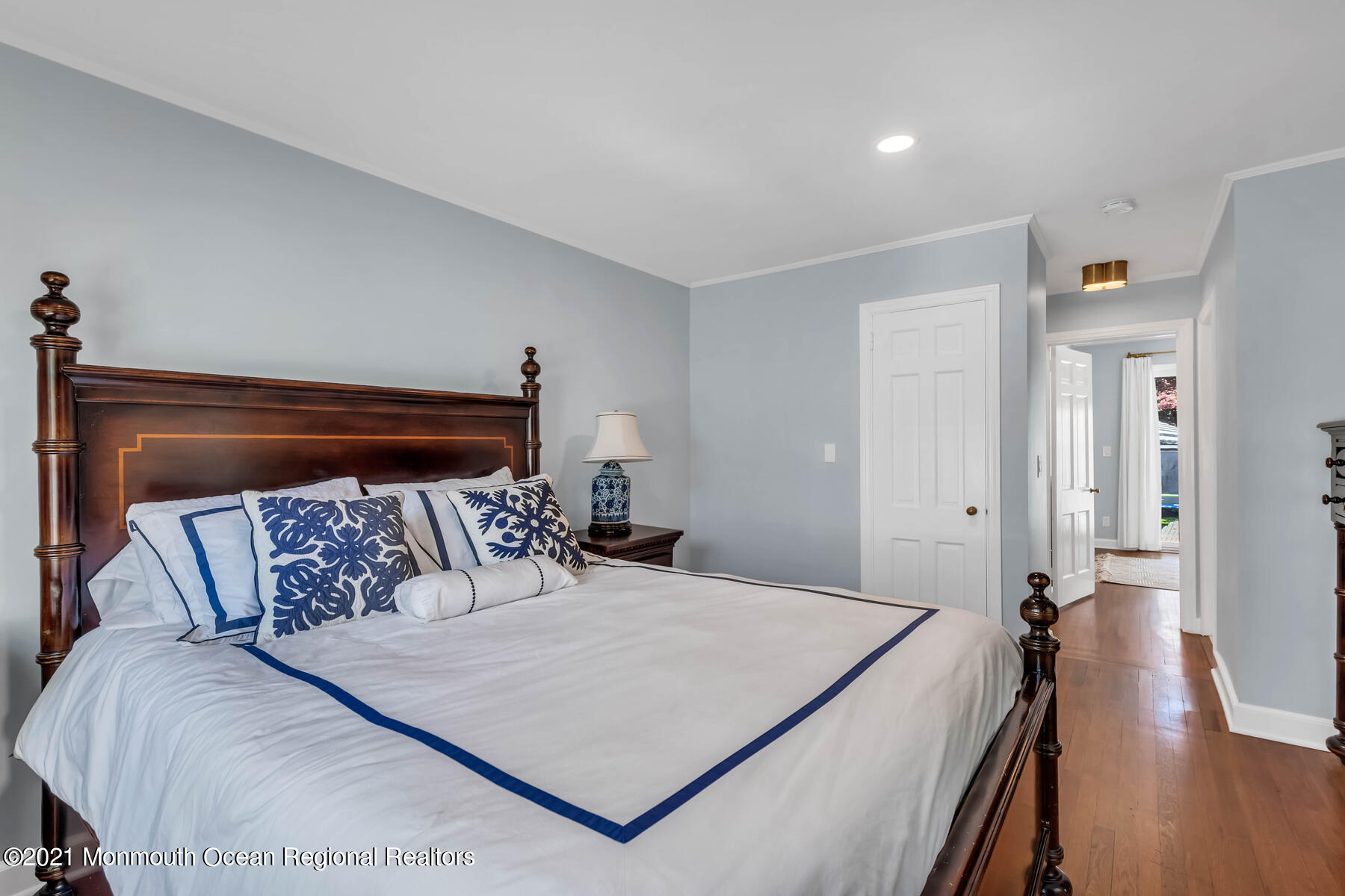 200 Lorraine Avenue Spring Lake, NJ 07762 - Photo 18 of 36 a bedroom with a bed and wooden floor