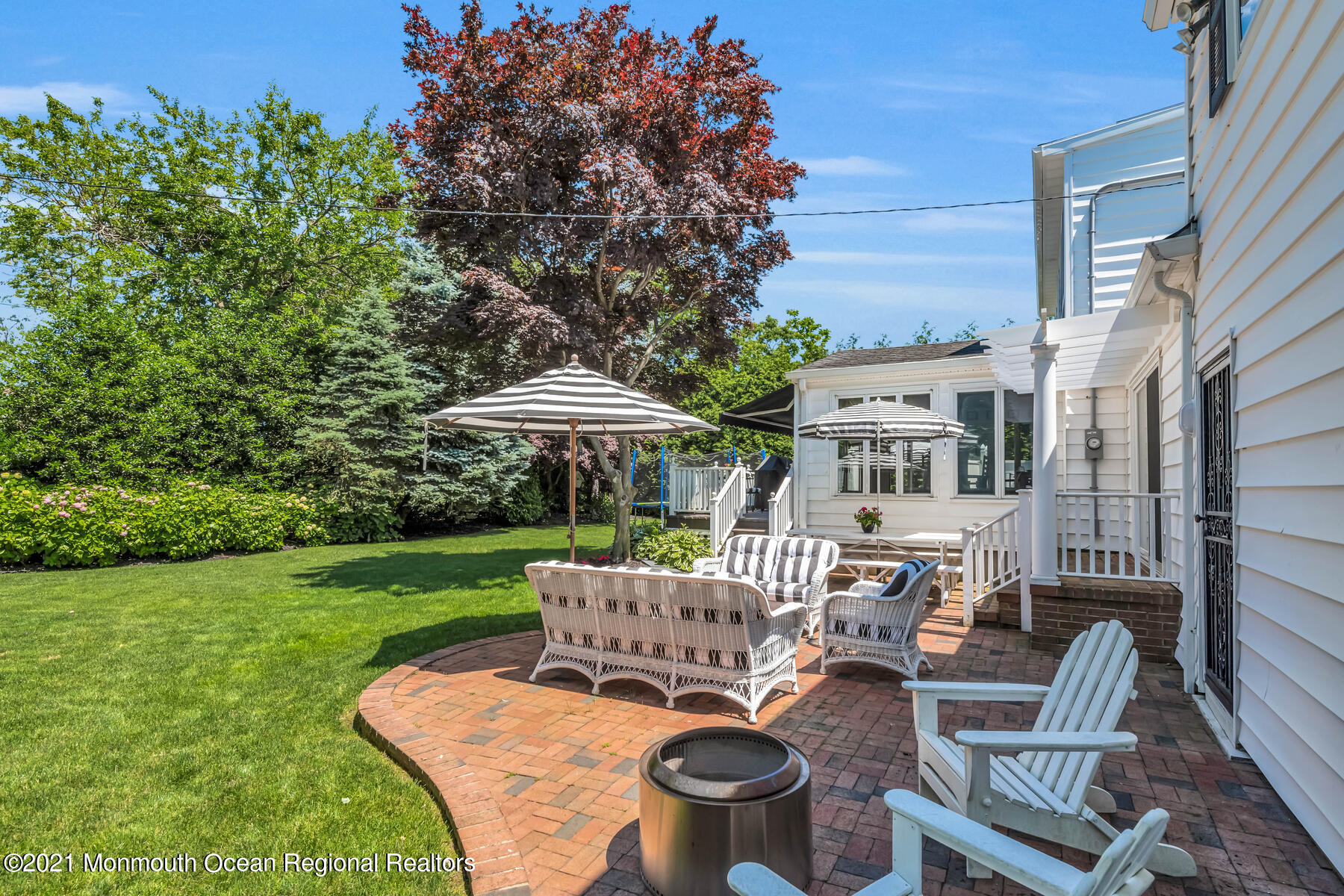 200 Lorraine Avenue Spring Lake, NJ 07762 - Photo 21 of 36 a view of a patio with chairs and a table